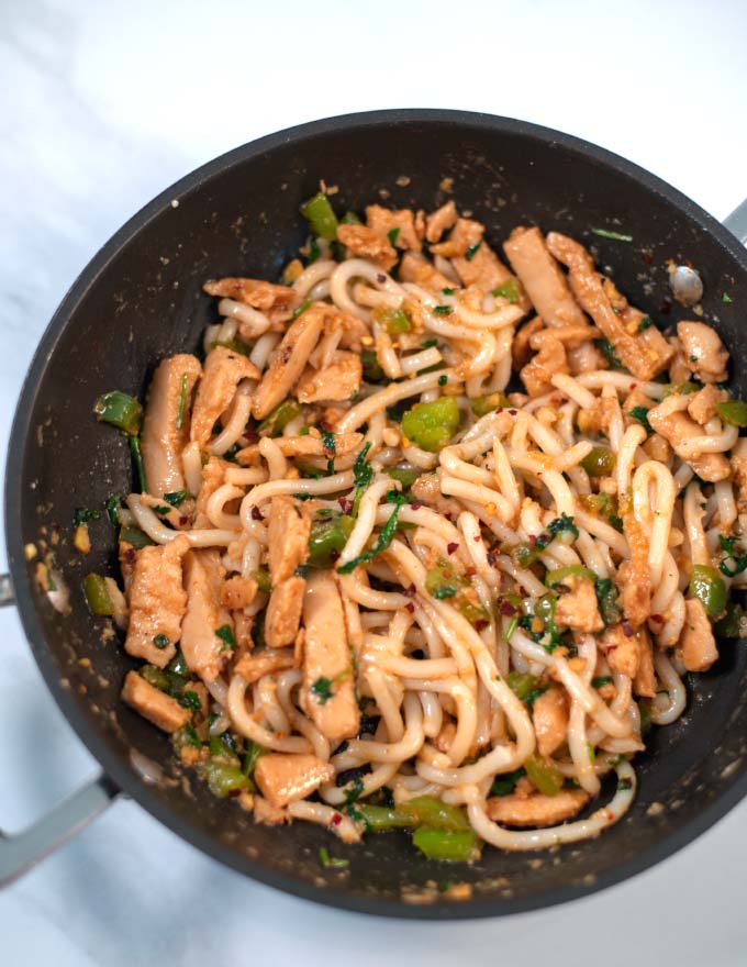 Pan full Spicy Thai Noodles with Chicken.