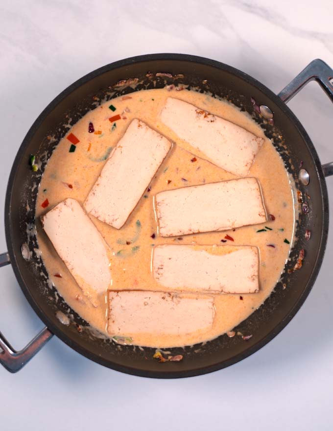 Sliced smoked tofu is given into the creamy coconut lime sauce.