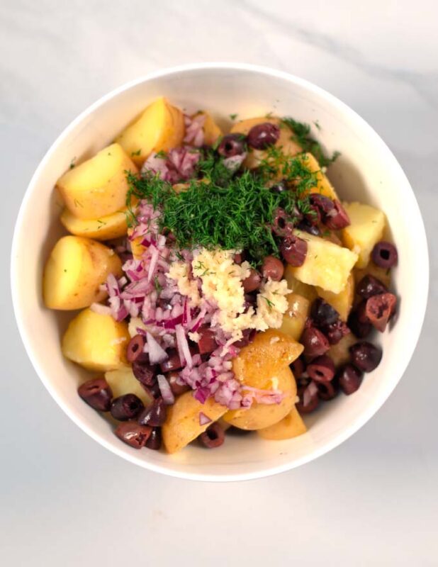 Fresh dill and lemon juice go into the bowl.