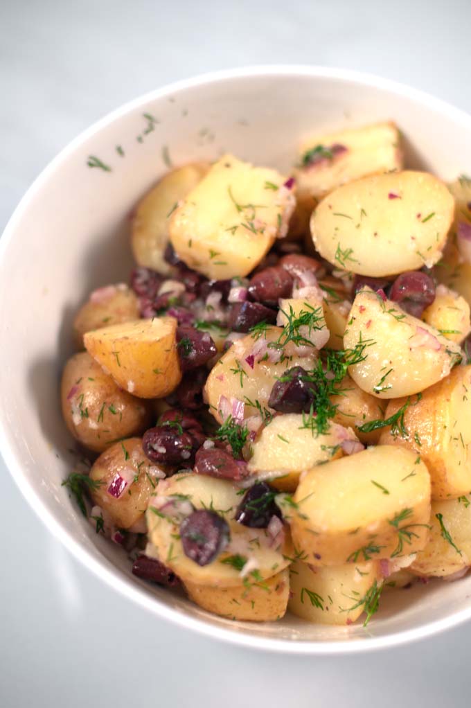 Fresh dill as garnish for Greek Lemon Potato Salad.