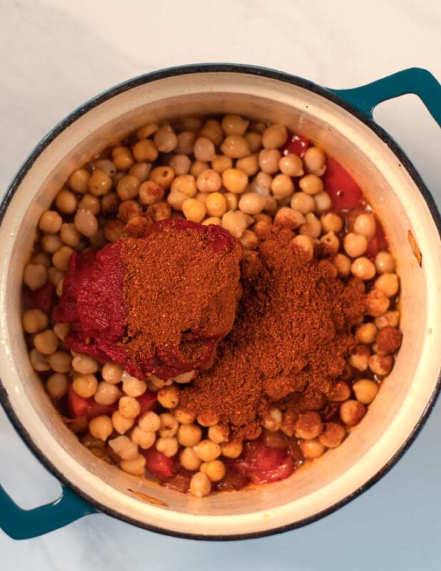 Chickpeas and spices added to the pot.