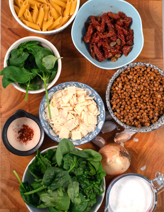 Ingredients needed to make Marry Me Pasta collected on a board.