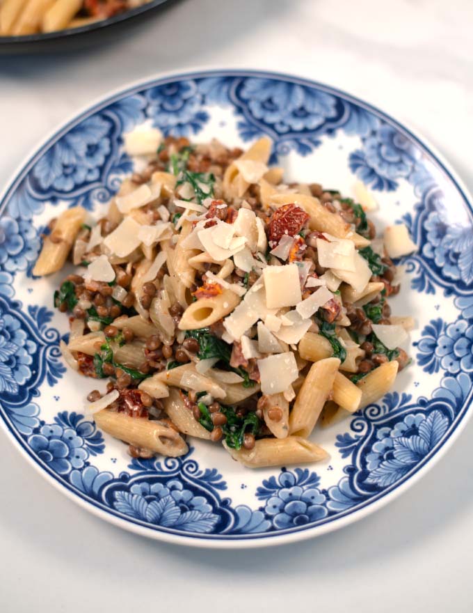 Fresh vegan parmesan flakes are used to top Marry Me Pasta.
