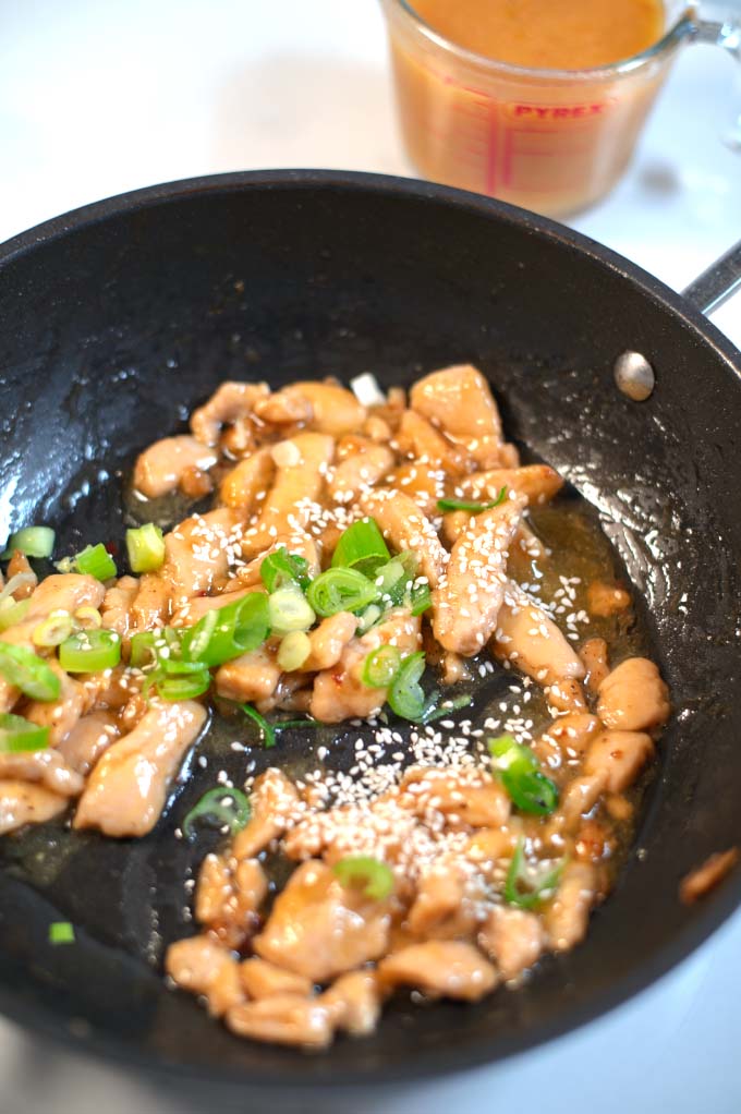A chicken stir fry marinated in orange sauce.