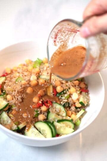 Dressing is poured over the Crispy Rice Salad.