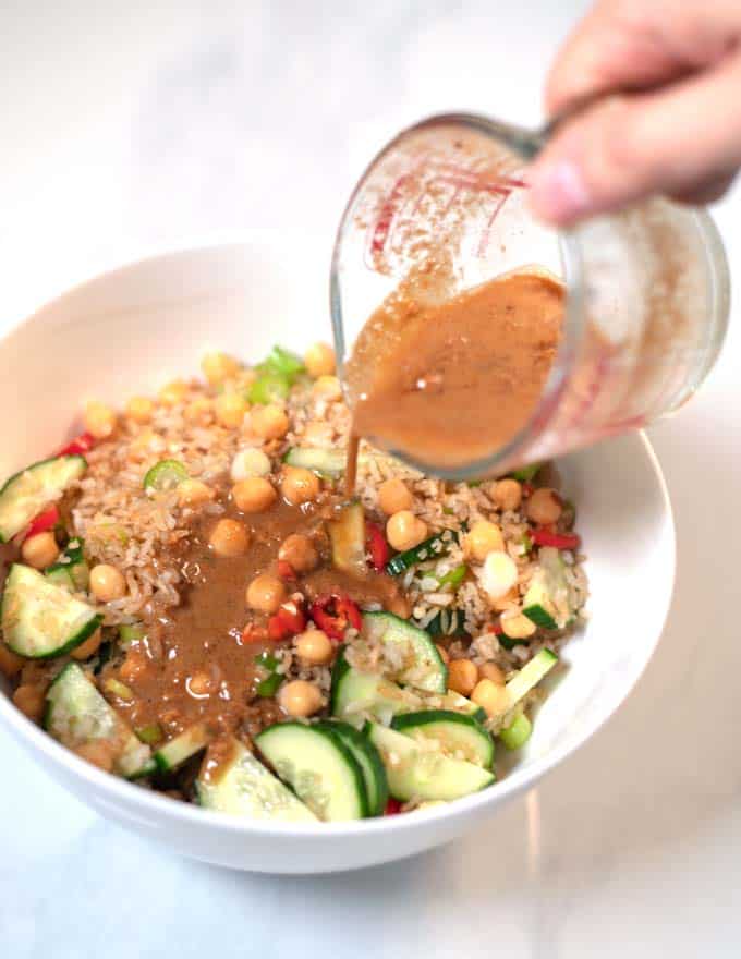 Dressing is poured over the Crispy Rice Salad.