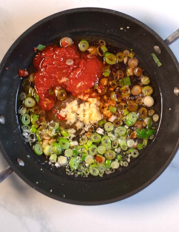 Sauce ingredients are added to the pan.