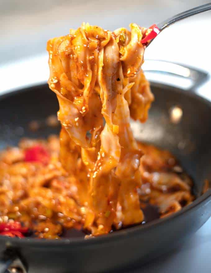 Closup of lifted Szechuan Noodles.