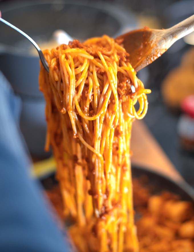 A huge amount of Filipino Pasta is lifted from the pan.