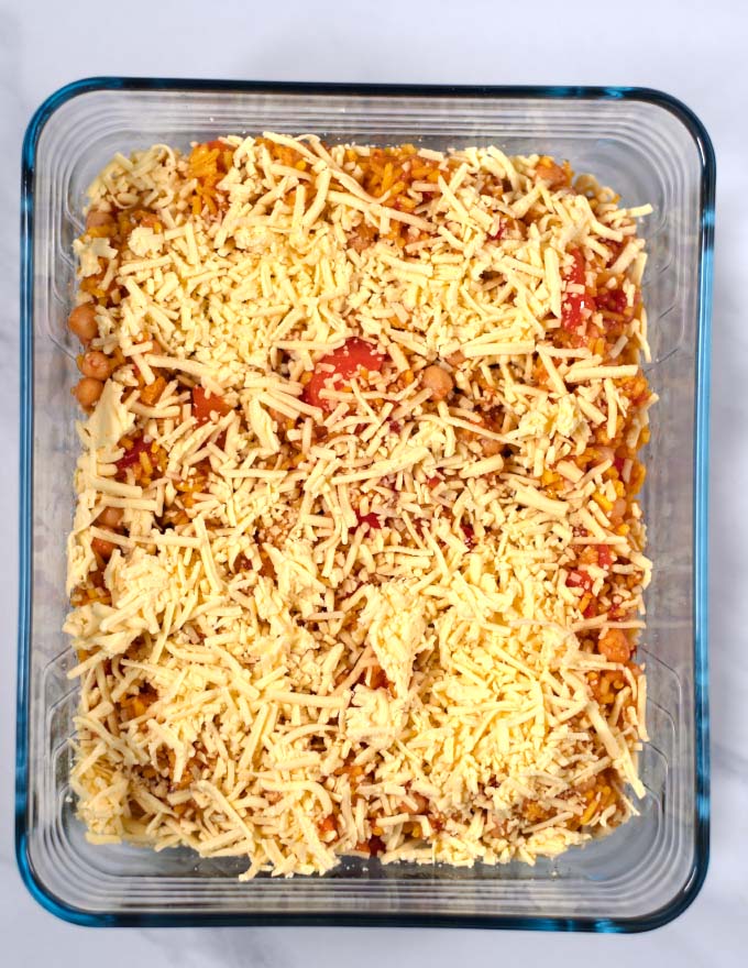 Leftover Spanish Rice Bake topped with dairy-free cheese before baking.