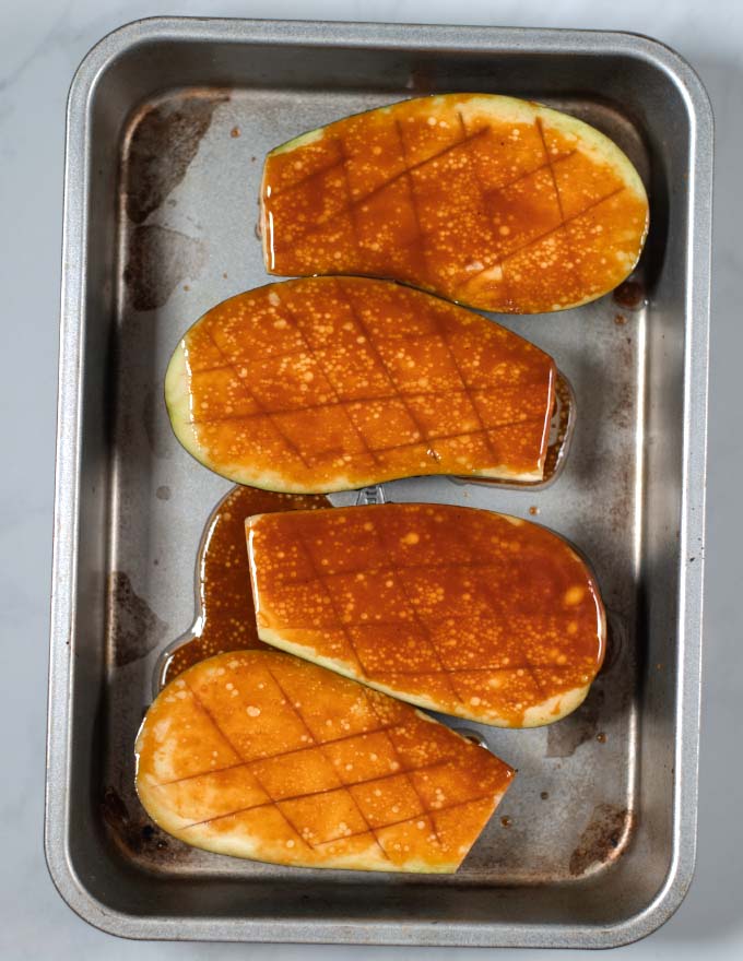 Eggplant halves coated in miso sauce.