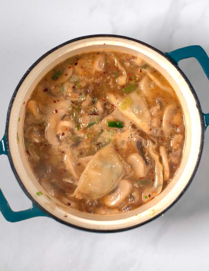 Cooked dumplings in broth.