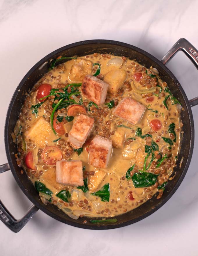 Fried and cripsy tofu cubes are added to the curry.