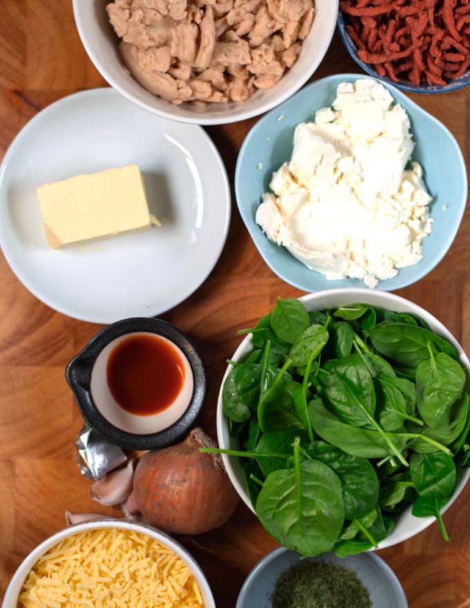 Ingredients needed to make Crack Chicken Soup on a wooden board.