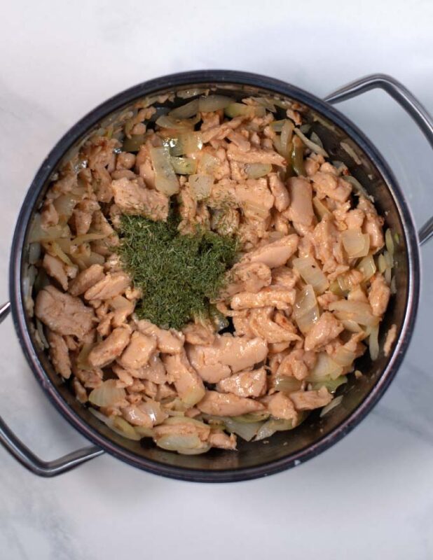 Plantbased chicken is cooked with onions in butter.