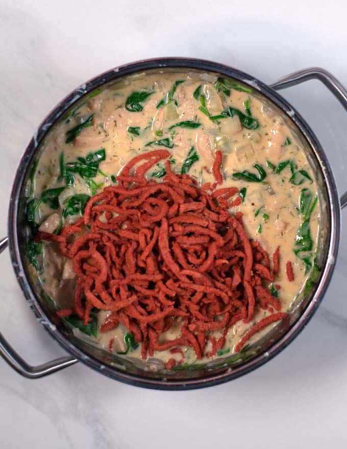 The pre-fried bacon is mixed with the soup.