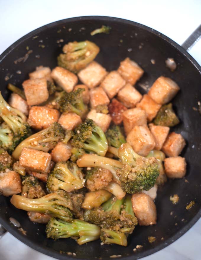 Closeup of Tofu and Broccoli in a pan.