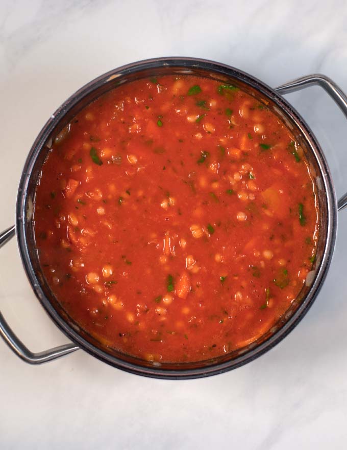 Tomato paste gives Fasolada its red color.