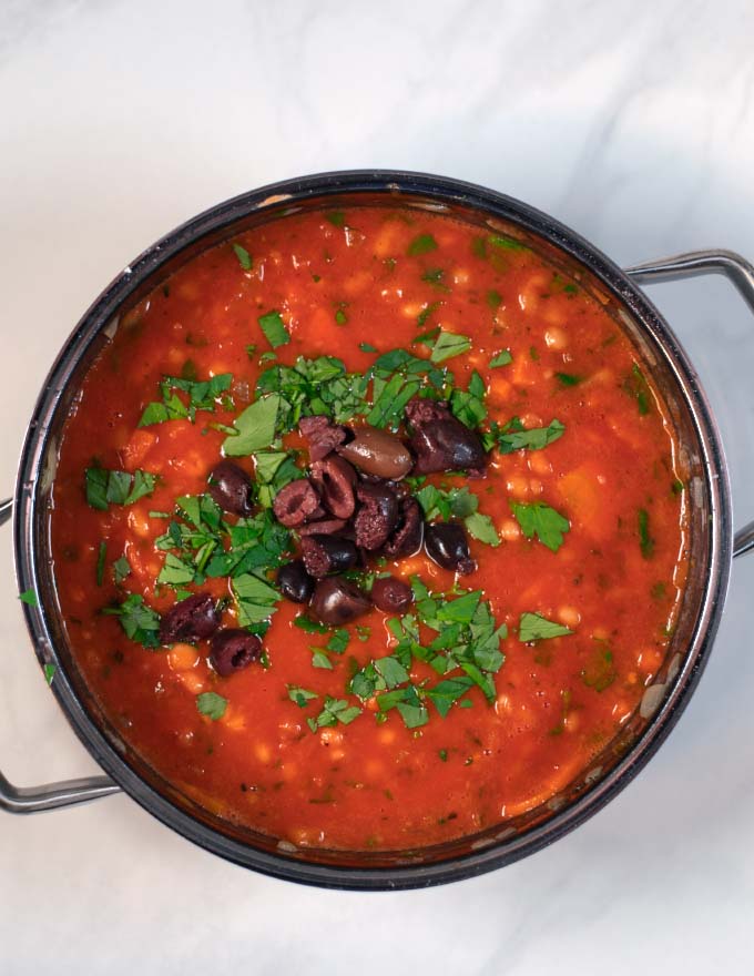 Black olives and more parsley are used for Fasolada garnish.